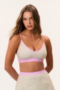 Ditsy floral sports bra with spaghetti straps and pink trim; V-neck front