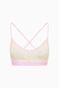 Ditsy floral sports bra, pale background with pink trim, crisscross open-back straps