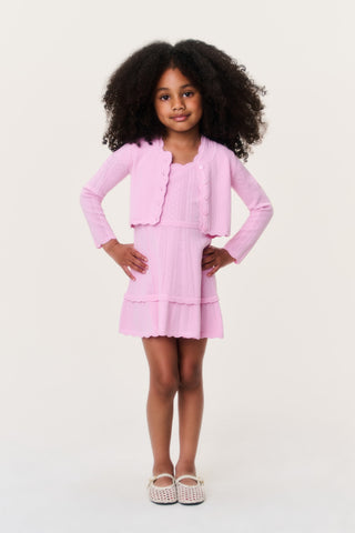 Girls pink pointelle knit cardigan with button front and scalloped ruffle hem