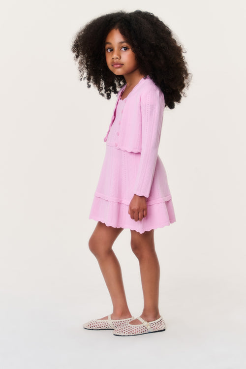 Girls pink pointelle knit cardigan with button front, long sleeves, ruffle trim