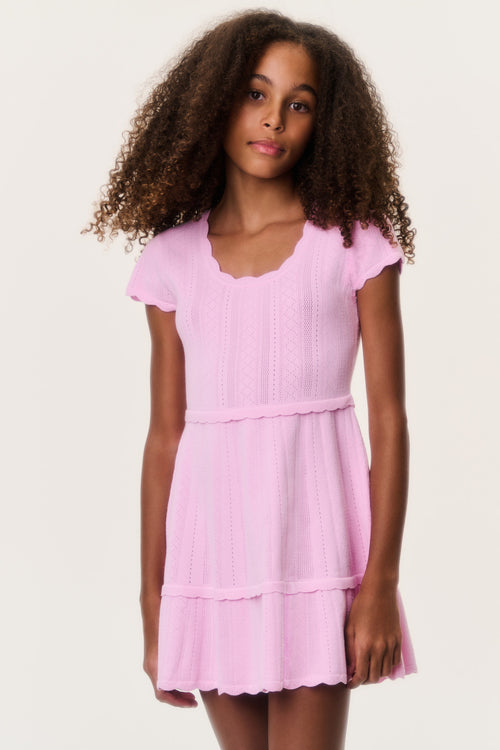 Tween stretch pointelle dress in light pink with ruffled tiers and flutter sleeves