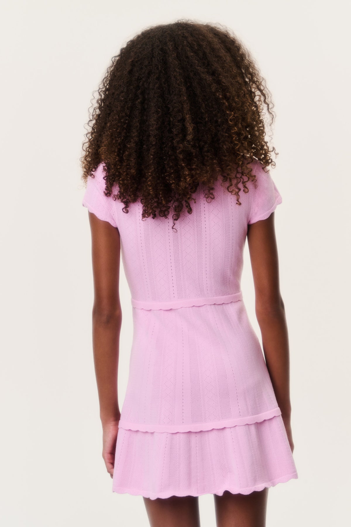 Tween stretch pointelle dress in light pink, short flutter sleeves, tiered hem
