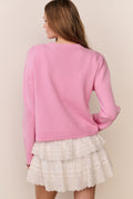 Pink pullover back view with ribbed hem and long sleeves
