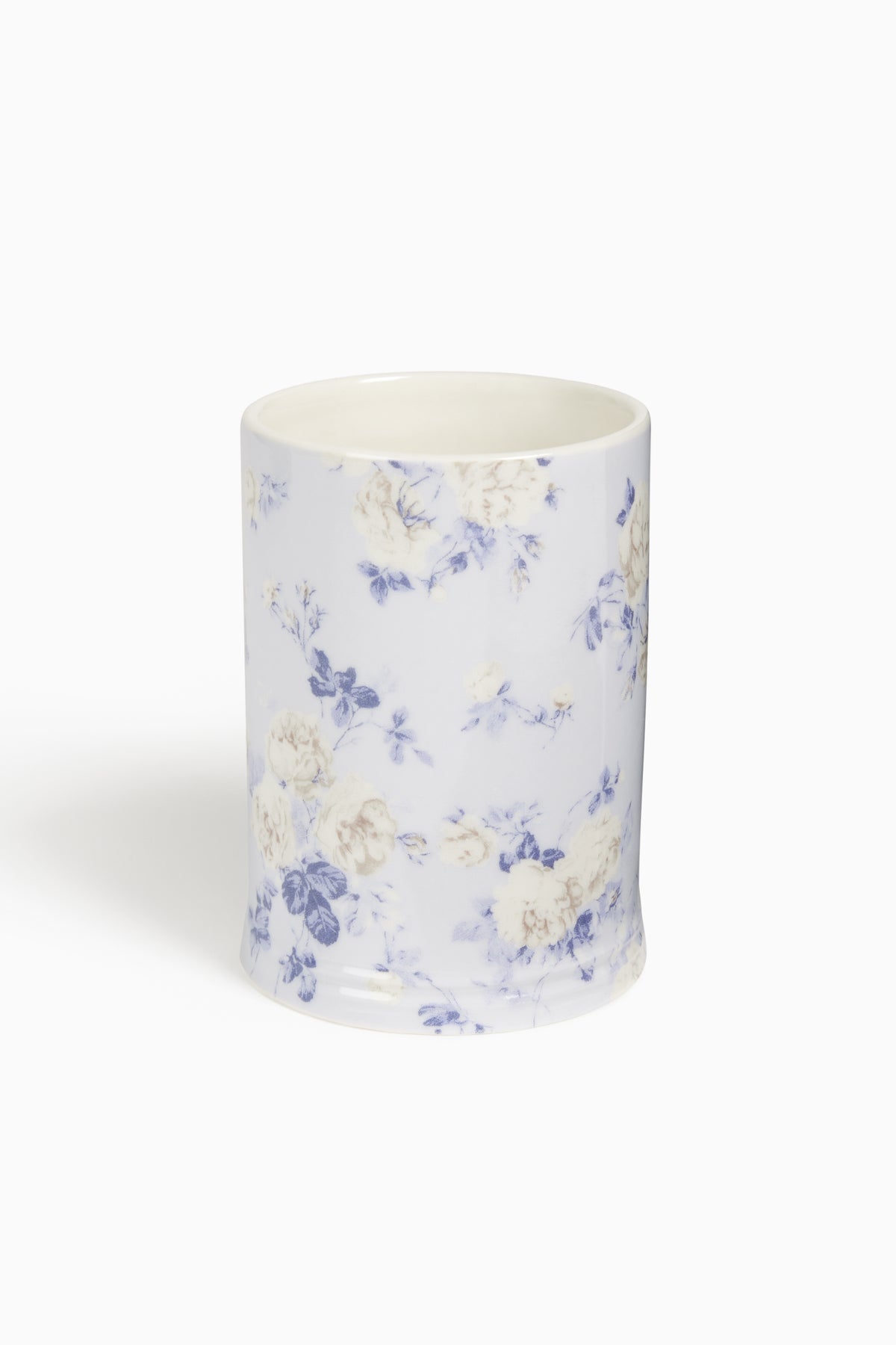 Porcelain tumbler with blue floral pattern on white