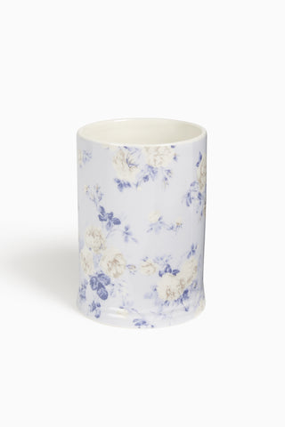 Porcelain tumbler with blue floral pattern on white
