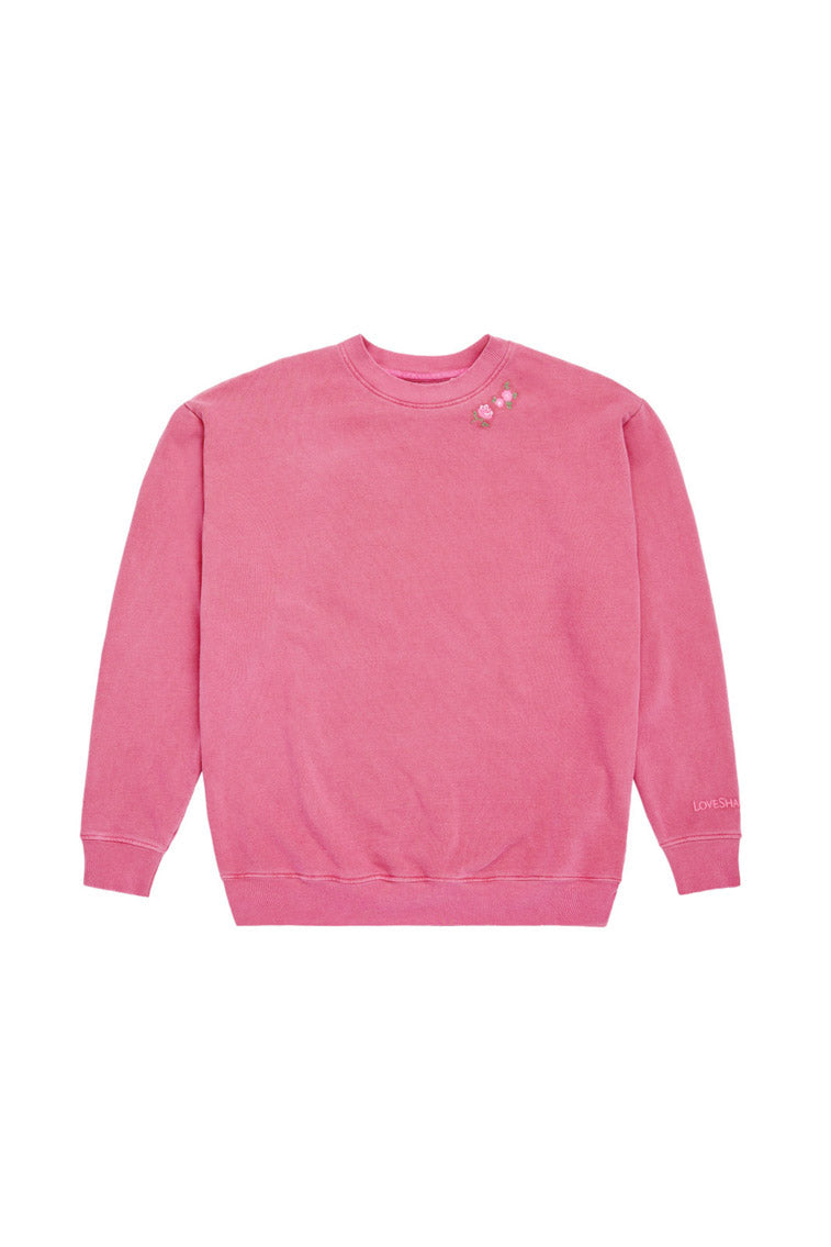 Pink crewneck pullover sweatshirt with small chest logo graphic