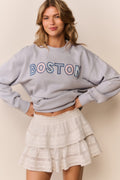 Palo Location pullover in light blue with 'BOSTON' graphic, long sleeves