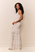White sleeveless pointelle maxi dress with thin straps and textured tiered hem