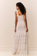 White tiered pointelle maxi dress with spaghetti straps, backless style and flowing skirt