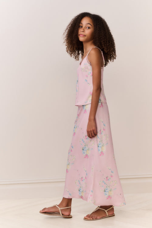 Light pink floral maxi skirt in side profile, long flowing length