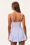Light blue tennis print active dress back view with thin straps and flared skirt