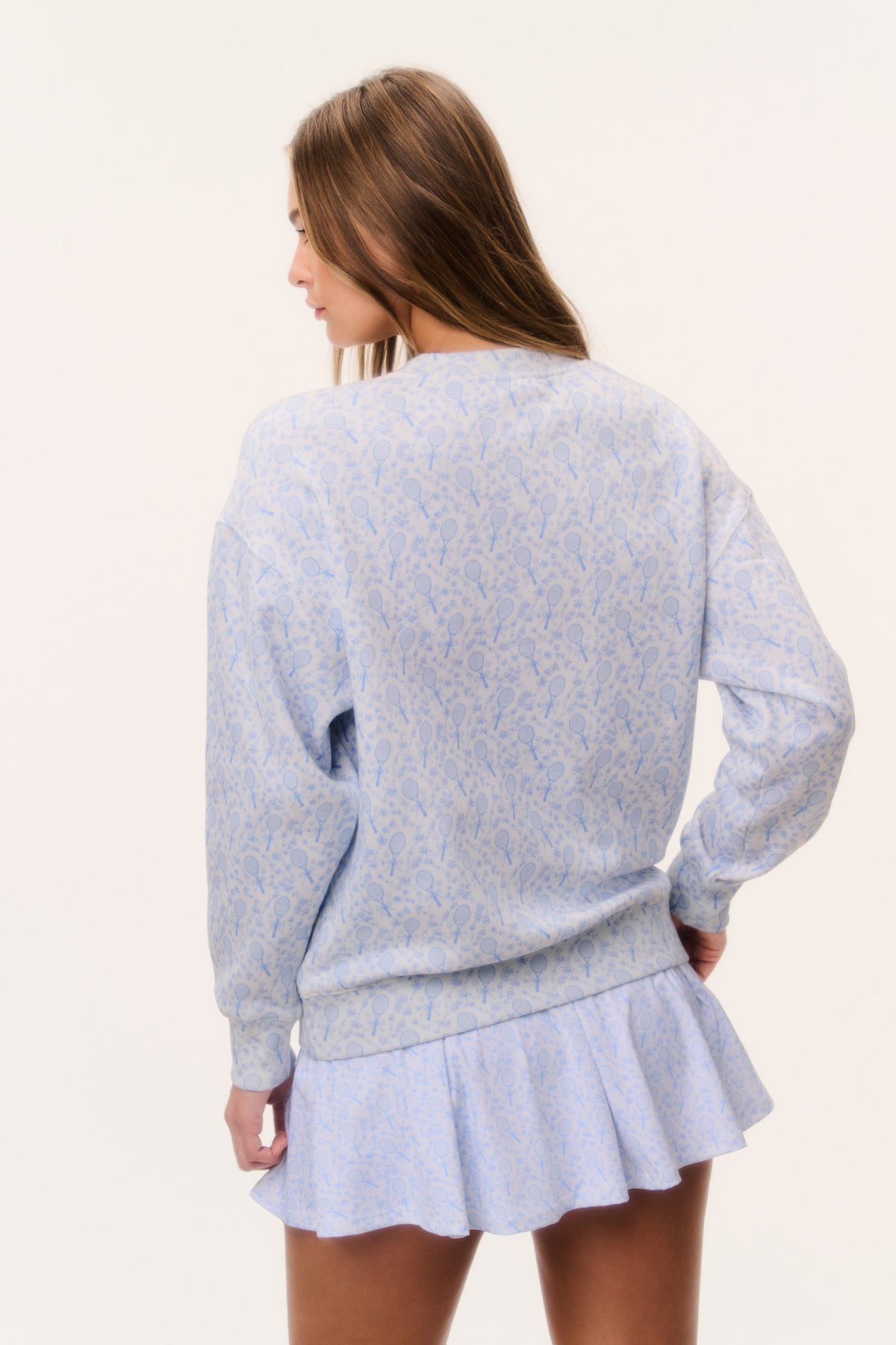 Light blue tennis print pullover with crew neck, long sleeves, back view