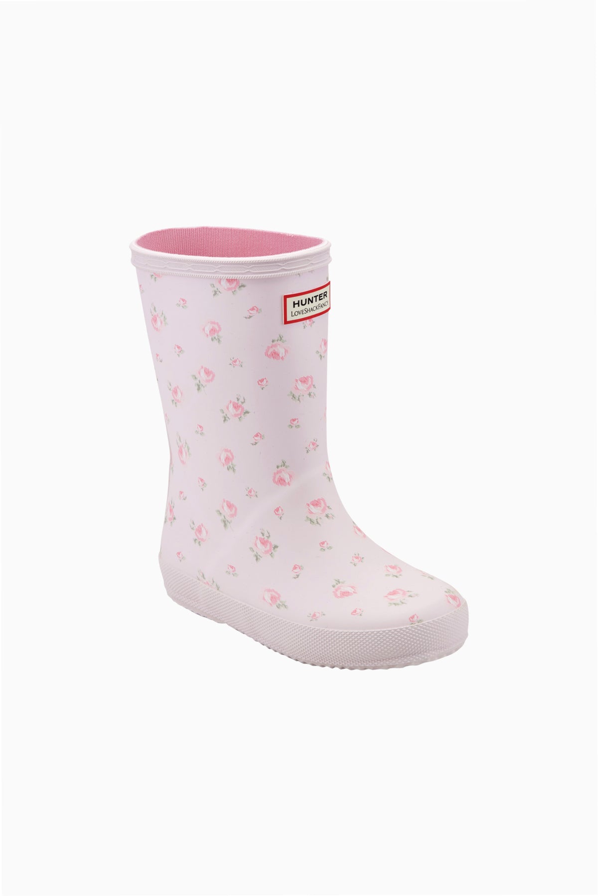Kids rain boot with light pink floral pattern and molded Hunter logo badge.