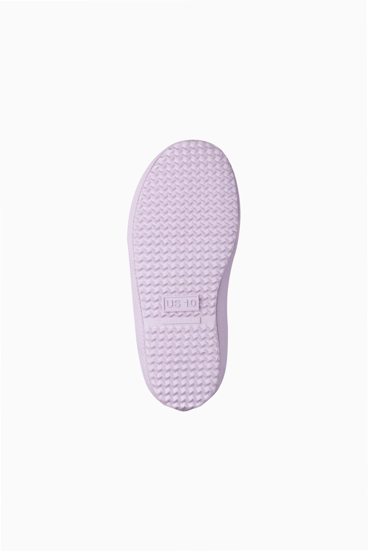 Underside view of kids rain boot sole in light lavender rubber tread.