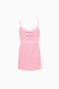 Pink tweed sleeveless dress with bow front and thin straps