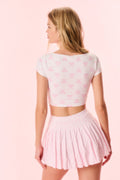 Cropped active top back view with pink bow print
