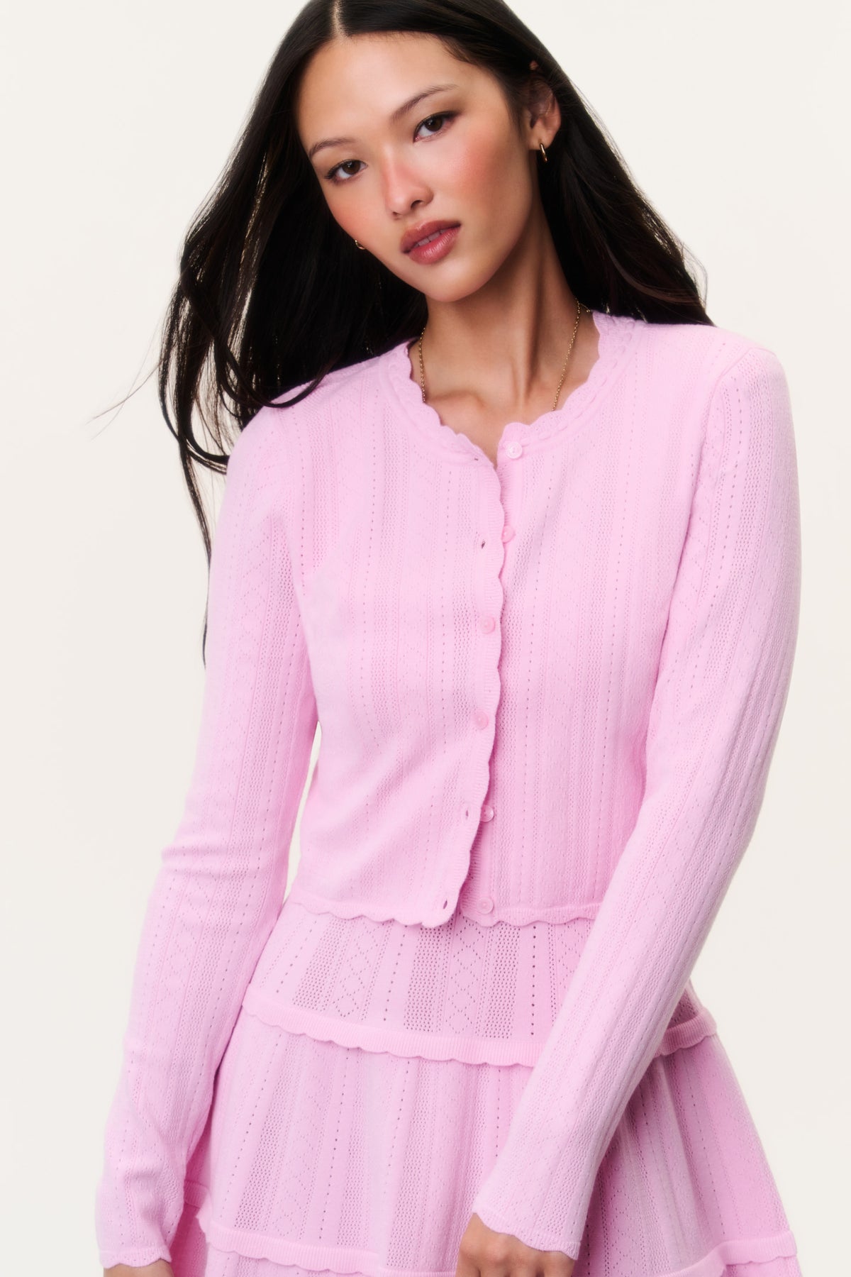 Stretch pointelle cardigan in candy floss pink, button-front with scalloped trim