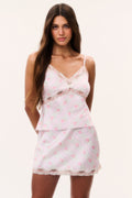 Pink mini satin slip skirt with floral print and scalloped lace edge hem