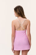 Back view of tween pink ditsy floral active dress with crisscross straps