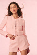 Pink cropped jacket with ruffled lace trim and textured front panel