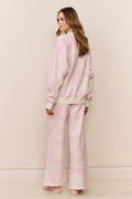 Back view of pink heart-print fleece pullover and matching pants, long sleeves