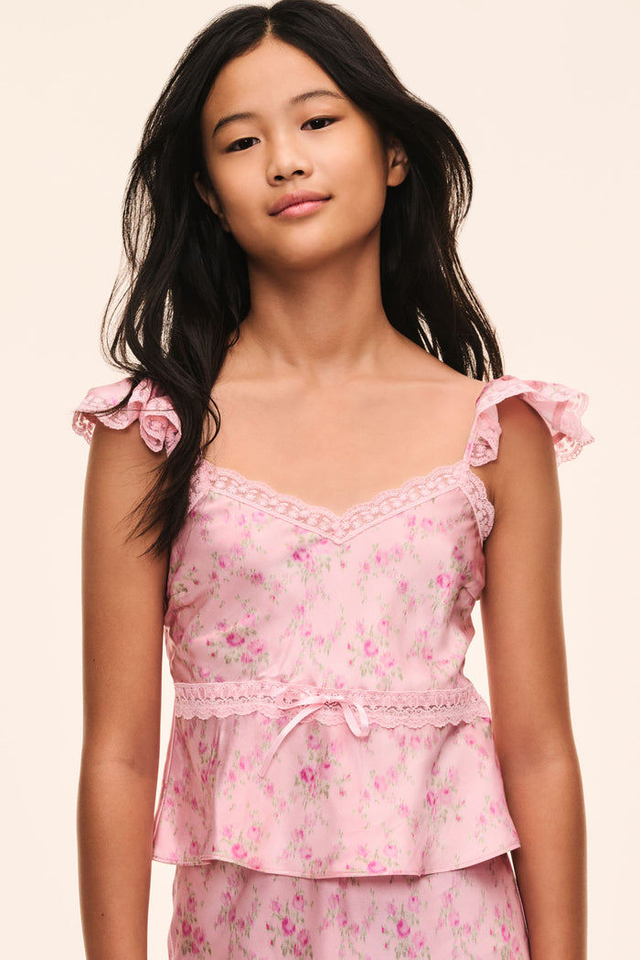 Pink floral peplum top with lace trim, bow-tied ruffles at shoulders