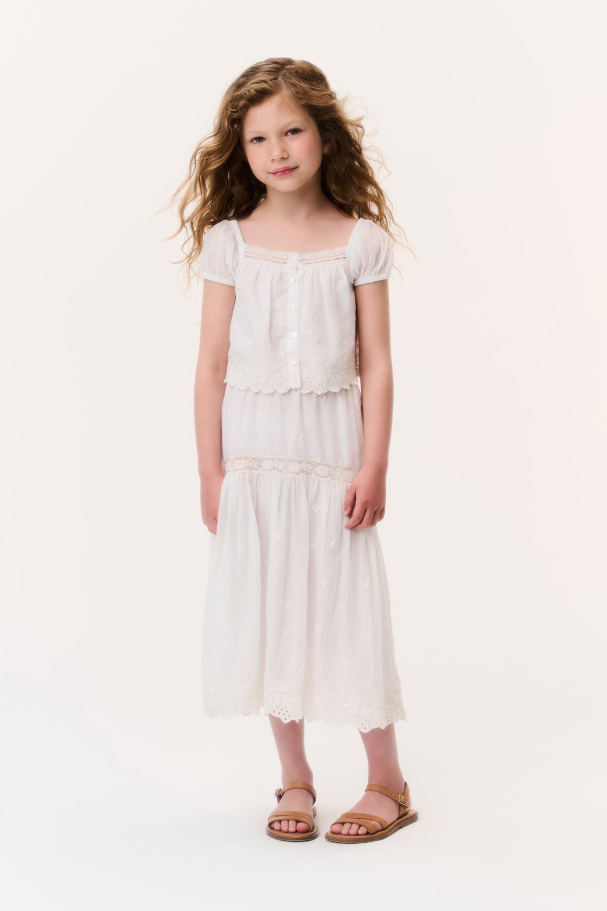 Ivory cotton lace girls' tiered skirt with scalloped hem and elastic waistband