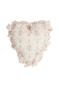 Heart-shaped ruffle pillow with blush floral print and layered ruffled edge