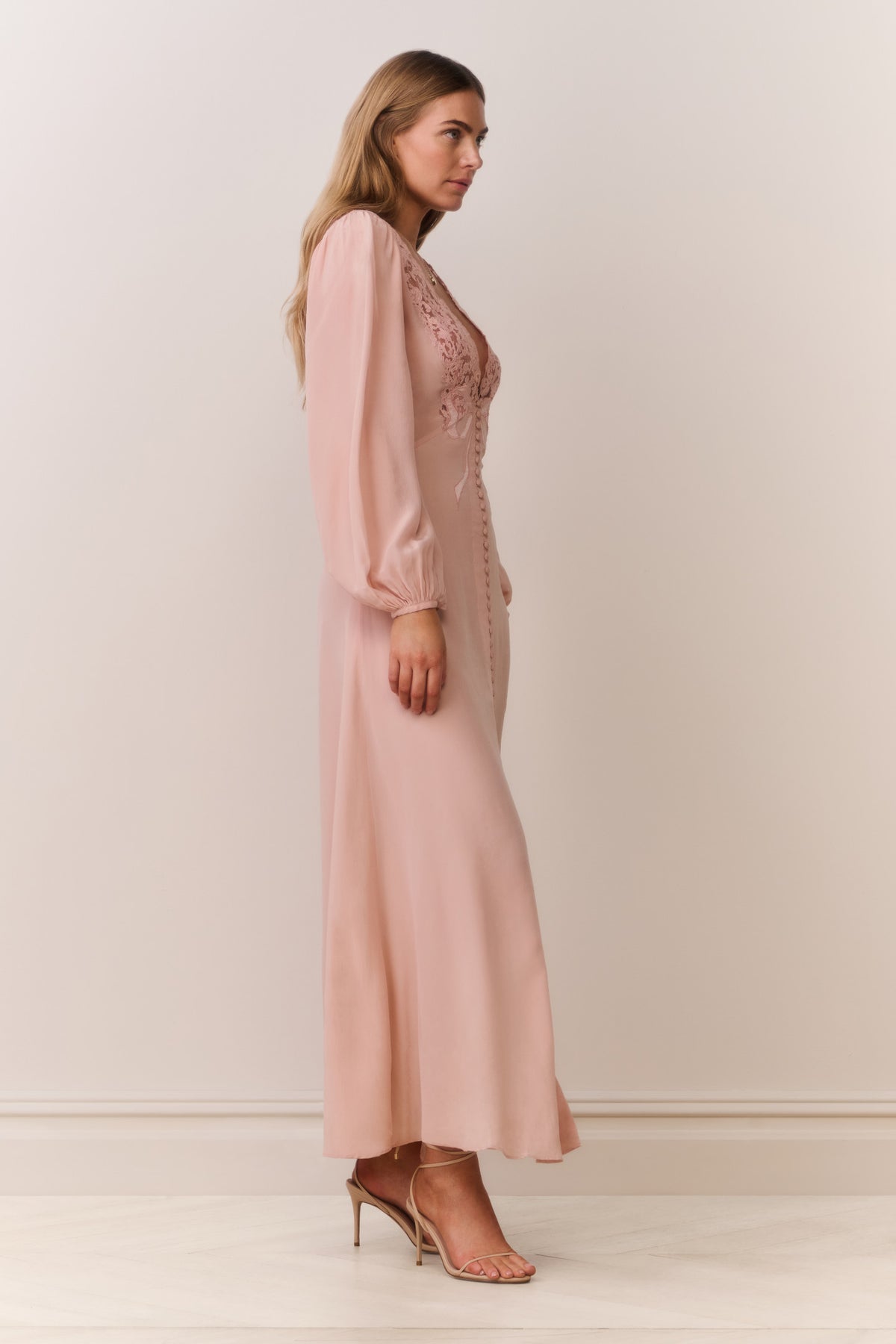 Light pink silk maxi dress with lace trim bodice and long puff sleeves