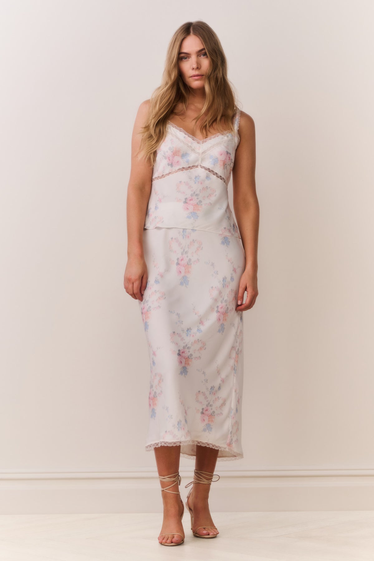 Floral print slip skirt with lace-trim hem, pastel blue and pink pattern