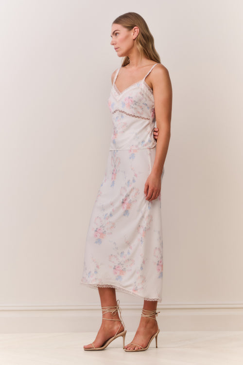 Floral print slip skirt in light pastel tones, lace-trim hem