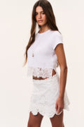 Optic white embroidered mini skirt with lace trim at waist and hem