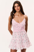 Pink floral cotton mini dress with V neckline, smocked bodice, and tiered skirt