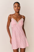 Pink floral print mini slip dress with lace-trim V neckline and scalloped lace bust