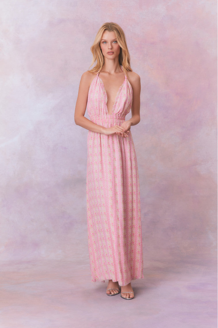 Pink floral print halter maxi dress with ruched bodice and tiered skirt