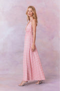 Pink floral print halter maxi dress, side view with open tie neckline