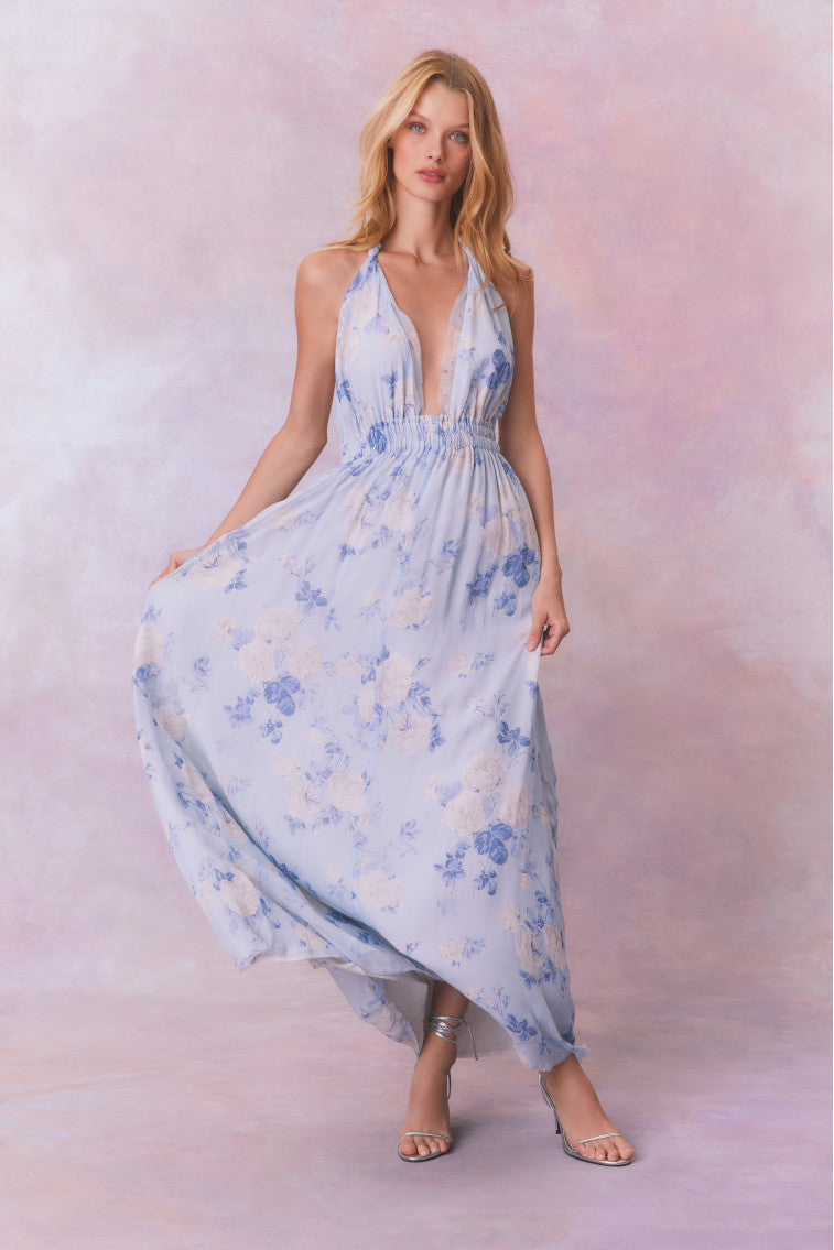 Light blue floral halter maxi dress with flowing, draped skirt and strappy neckline