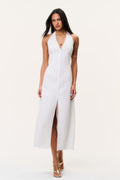 White sleeveless halter maxi dress with front buttons and center slit.