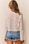 White cotton eyelet blouse with scalloped ruffle collar and button front, long sleeves