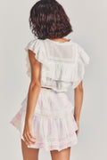 Back view of ruffle mini heritage skirt with gathered waist and tiered pastel ruffles