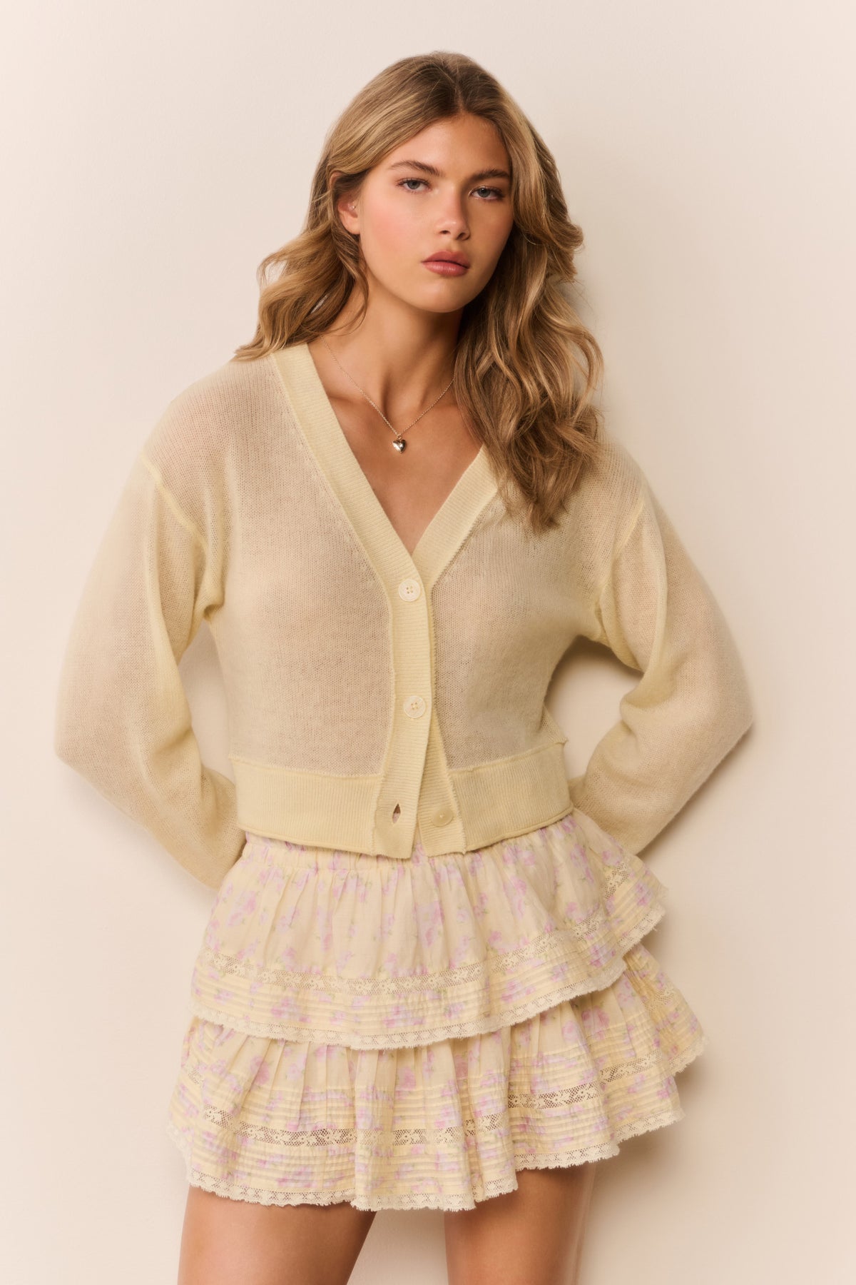 Tiered ruffle mini skirt in pale yellow with small floral print, tiered hem