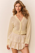 Tiered ruffle mini skirt in pale yellow floral print with layered hem