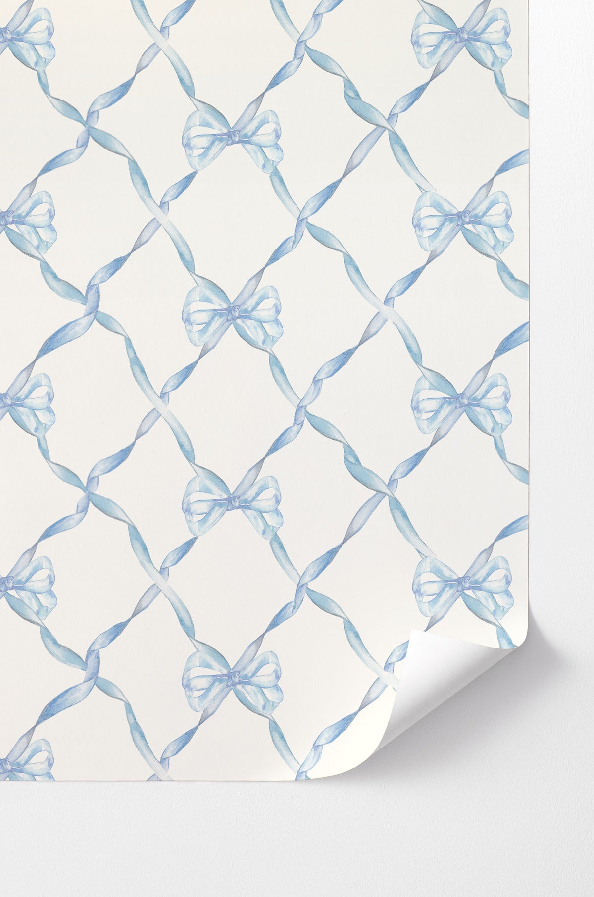 Peel-and-stick wallpaper with light blue bow pattern on white background
