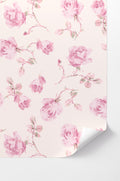 Pink rose peel-and-stick wallpaper with soft floral pattern, corner curl visible