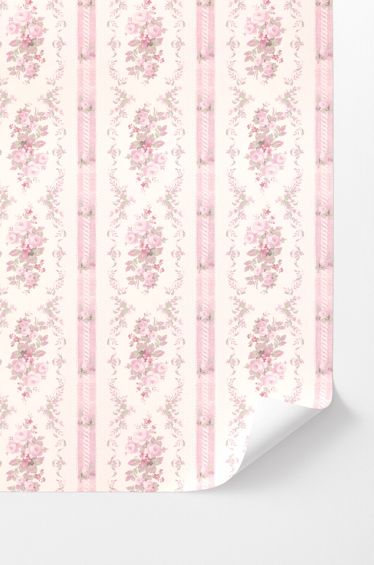 Peel-and-stick wallpaper corner with pink floral vertical stripe pattern