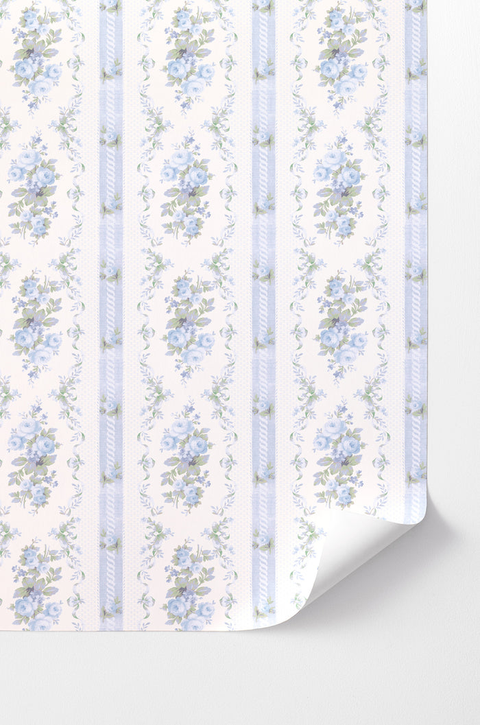 Peel-and-stick wallpaper with light blue floral pattern and vertical stripe accents