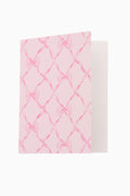 Card and envelope set with pink bow-pattern card and matching envelope