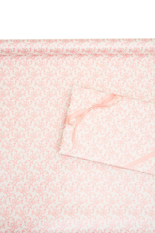 Pink gift wrapping paper with delicate bow and floral line pattern