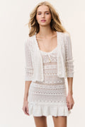 White cotton crochet cardigan with V-neck, long sleeves, lace-knit hem