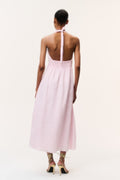 Light pink linen halter maxi dress with open back tie and center seam slit.
